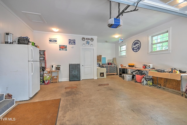 garage featuring a garage door opener and freestanding refrigerator