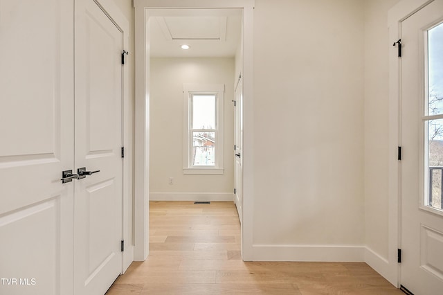 entrance foyer featuring recessed lighting, light wood-style flooring, and baseboards