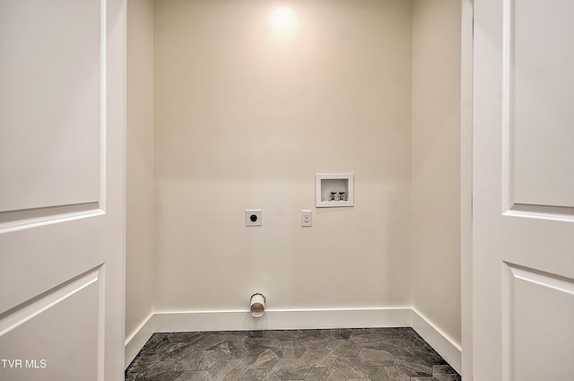 laundry area featuring laundry area, hookup for a washing machine, electric dryer hookup, and baseboards