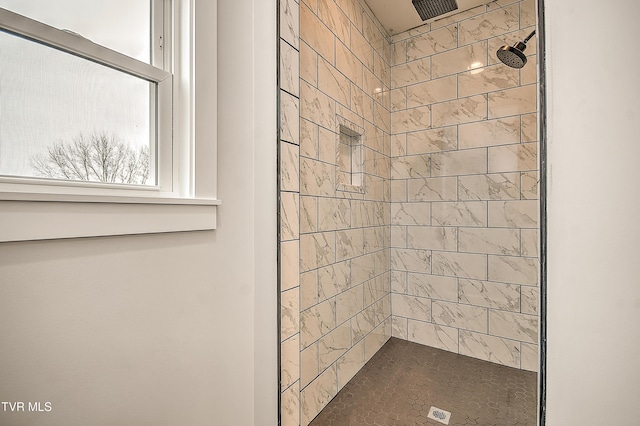 bathroom featuring tiled shower