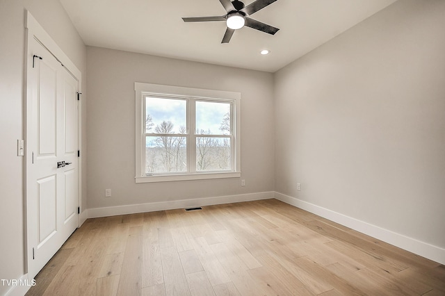 unfurnished bedroom with a ceiling fan, baseboards, visible vents, light wood finished floors, and recessed lighting