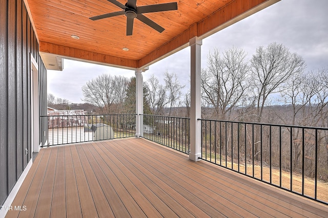 wooden terrace with a ceiling fan