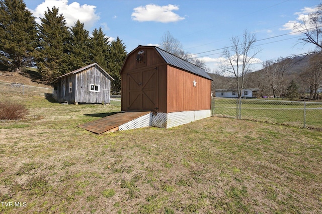 view of shed with fence