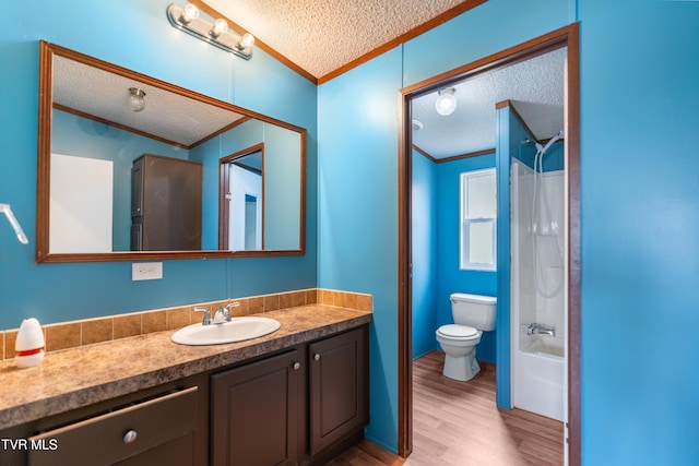 full bathroom featuring crown molding, a textured ceiling, and vanity