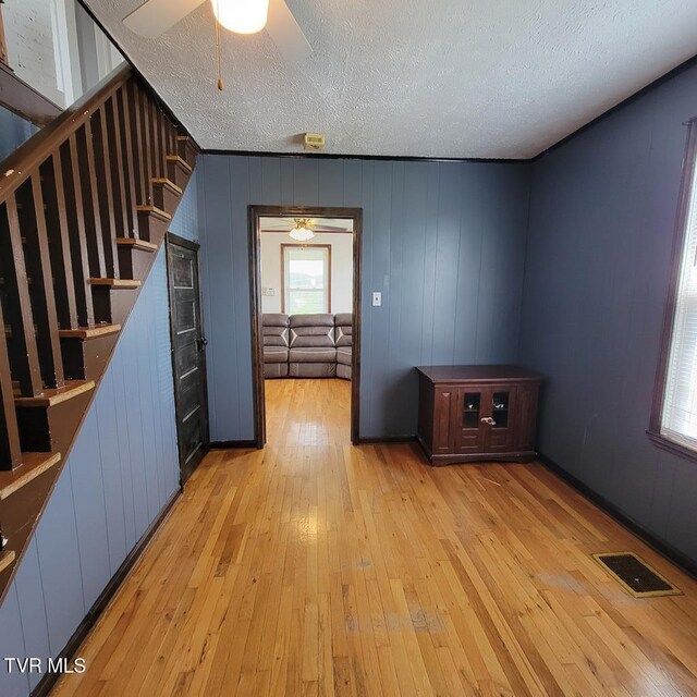 204 Highland Ave, Glade Spring, VA 24340 - interior space with a textured ceiling, light wood-style flooring, and stairway