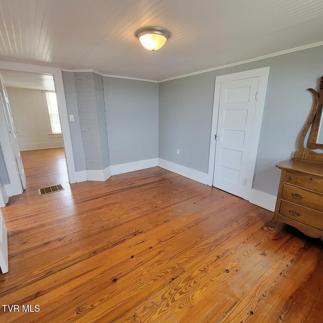 204 Highland Ave, Glade Spring, VA 24340 - spare room featuring wood-type flooring and ornamental molding