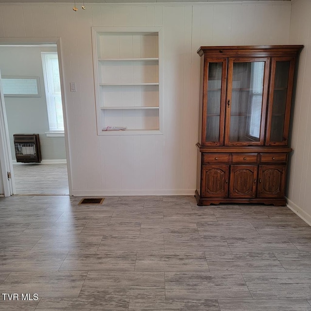 204 Highland Ave, Glade Spring, VA 24340 - unfurnished room featuring heating unit and built in shelves