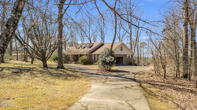 view of front of house featuring brick siding and driveway