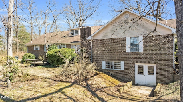 view of front of house with brick siding