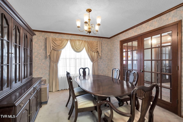 dining room with wallpapered walls, a notable chandelier, french doors, and light carpet