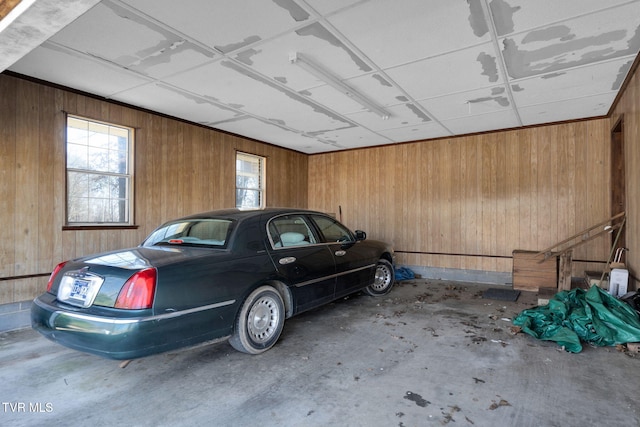 garage featuring wooden walls