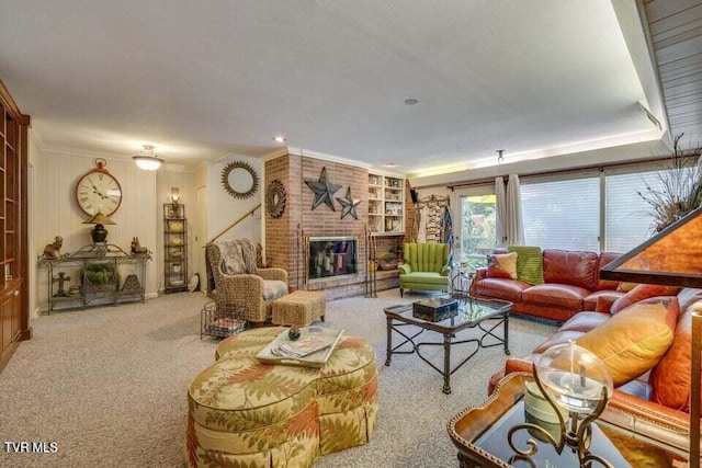 carpeted living room with a brick fireplace and crown molding