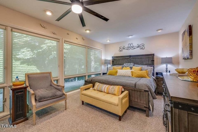 bedroom with a ceiling fan and carpet floors