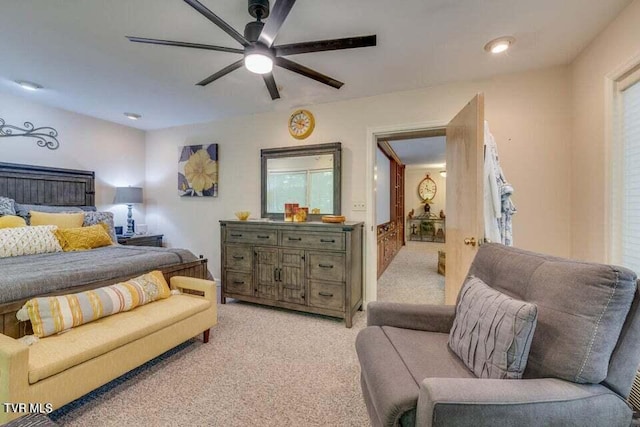 bedroom with light colored carpet and ceiling fan