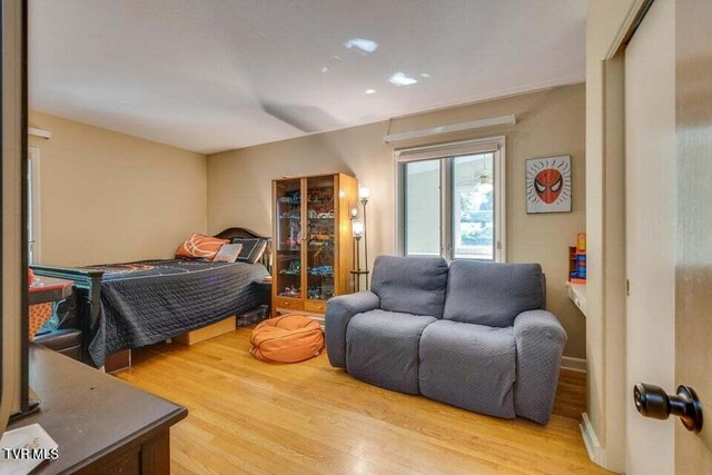 bedroom with wood finished floors