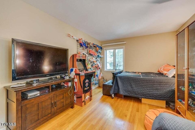 bedroom with wood finished floors