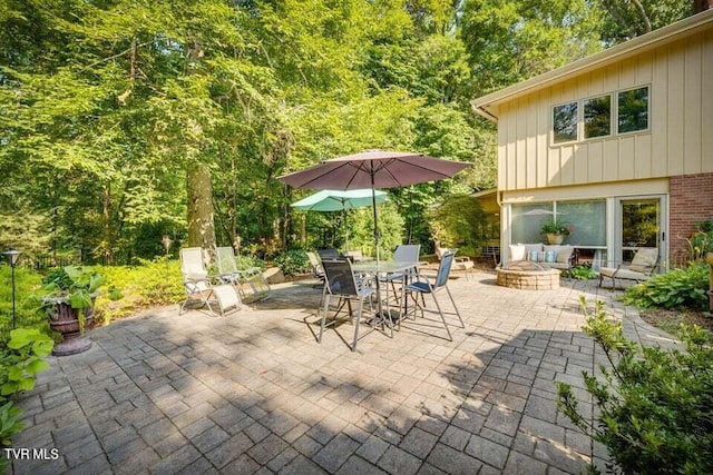 view of patio / terrace featuring an outdoor fire pit