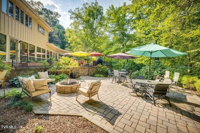 view of patio / terrace featuring a fire pit