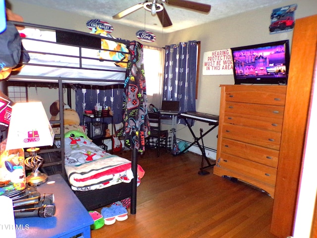 bedroom featuring wood finished floors and ceiling fan