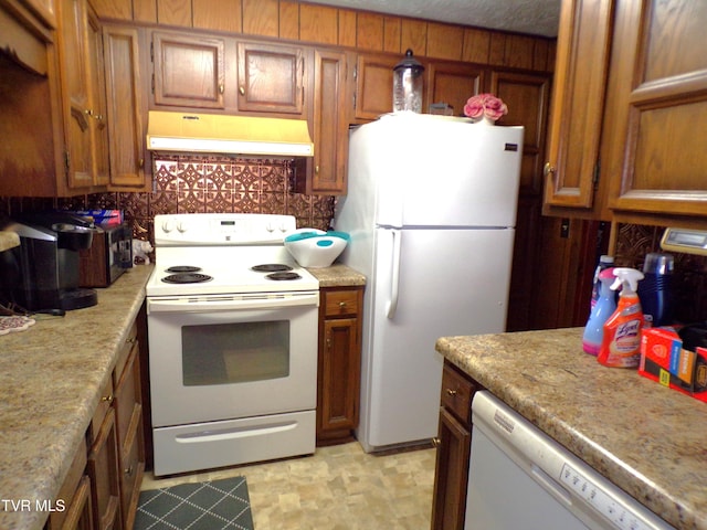 kitchen with range hood, white appliances, and brown cabinets