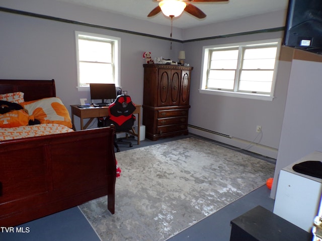 bedroom with a baseboard heating unit and a ceiling fan