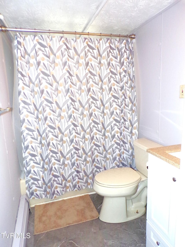 bathroom featuring curtained shower, toilet, vanity, and a textured ceiling