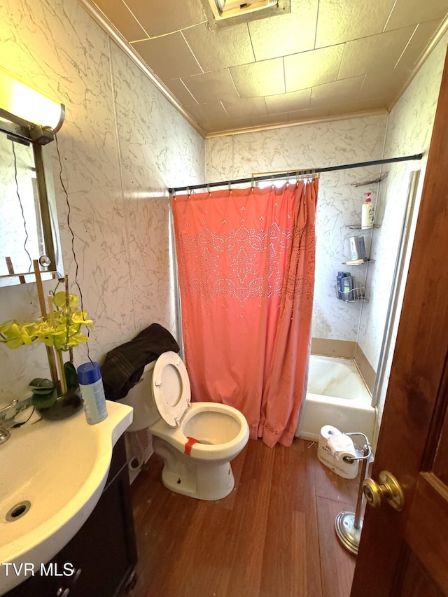 full bath with vanity, wood finished floors, shower / bath combo, and ornamental molding