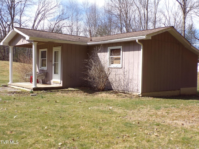 view of property exterior with a lawn