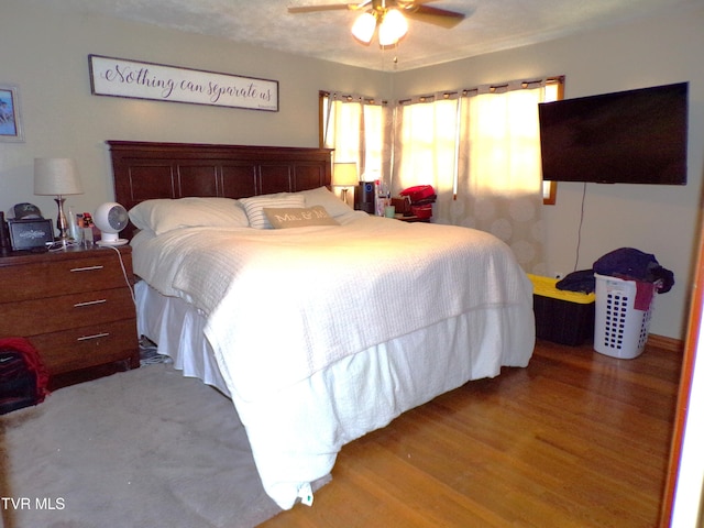 bedroom featuring wood finished floors and ceiling fan