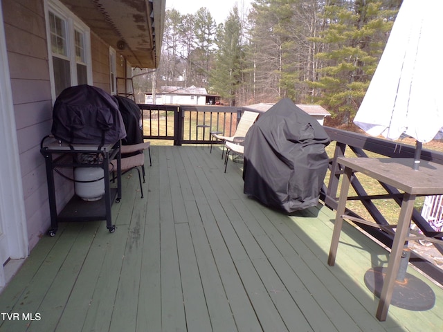 wooden deck with grilling area