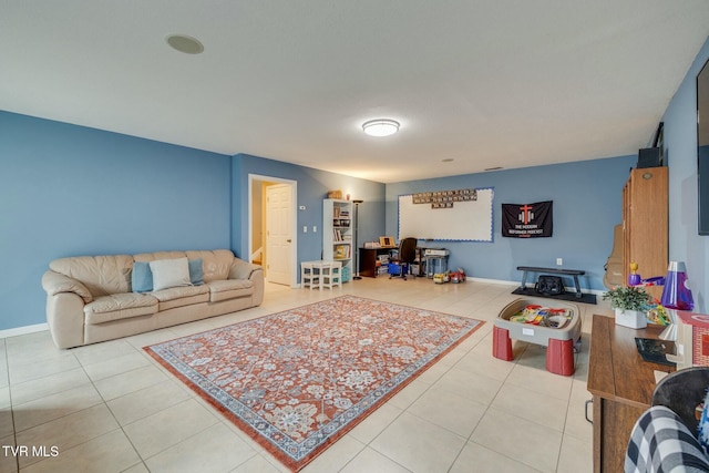 living area with light tile patterned floors and baseboards