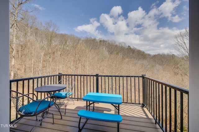 balcony with a forest view