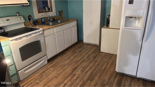 kitchen with a sink, white appliances, white cabinets, extractor fan, and dark wood-style flooring