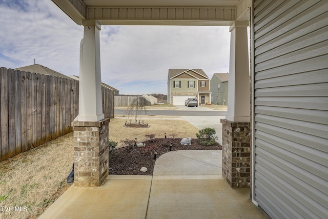 view of patio / terrace featuring fence