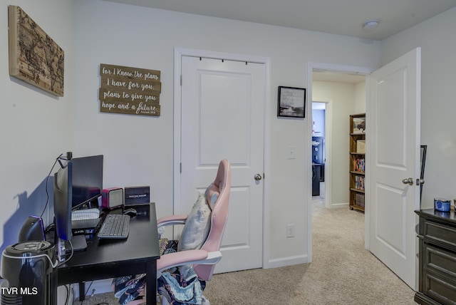 carpeted home office with baseboards