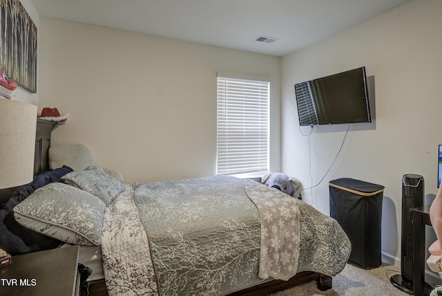 bedroom featuring visible vents and carpet