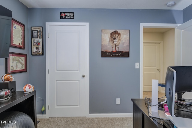 office space with carpet and baseboards