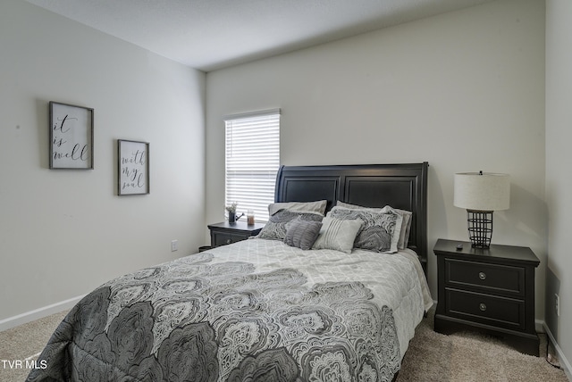 bedroom featuring baseboards and carpet floors