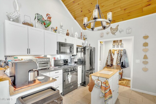 kitchen featuring black appliances, decorative light fixtures, wood ceiling, a notable chandelier, and white cabinetry