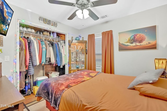 bedroom featuring a closet, visible vents, and a ceiling fan