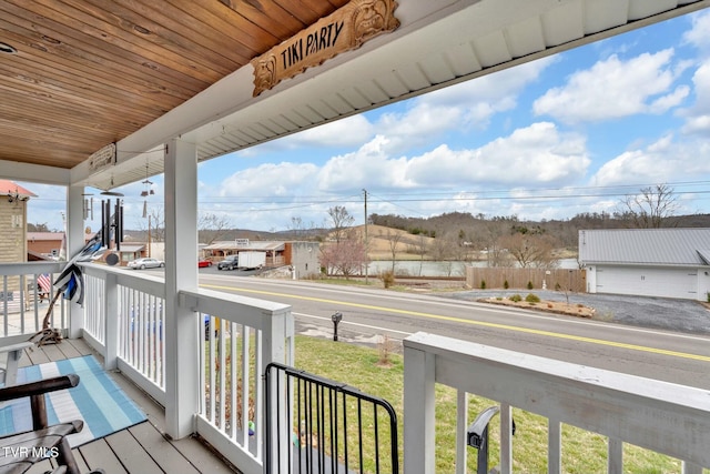 balcony with covered porch and a residential view