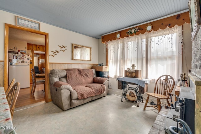 living room featuring wainscoting and wood walls