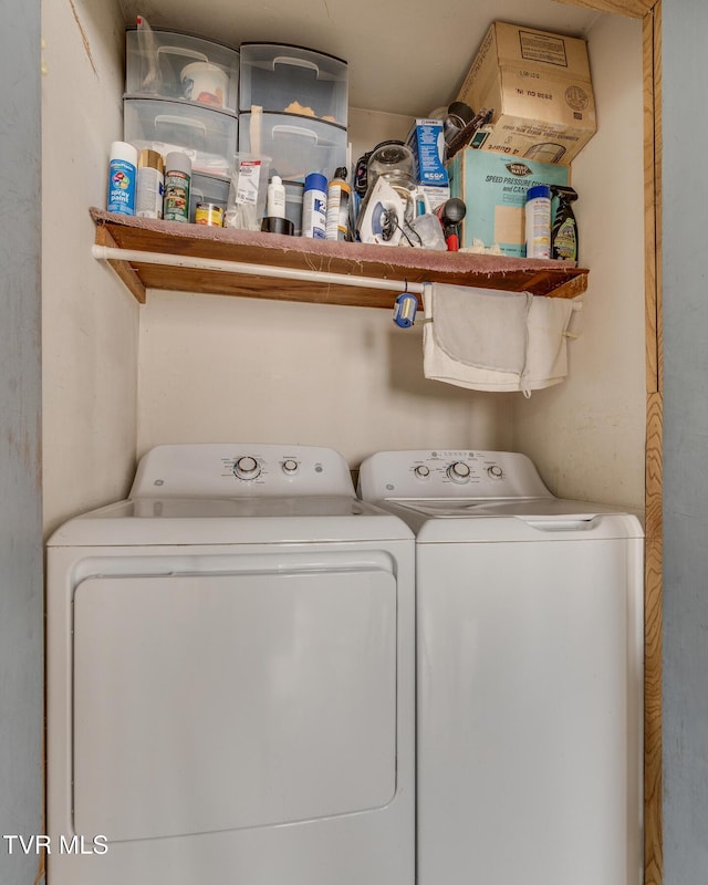 clothes washing area with laundry area and washer and dryer