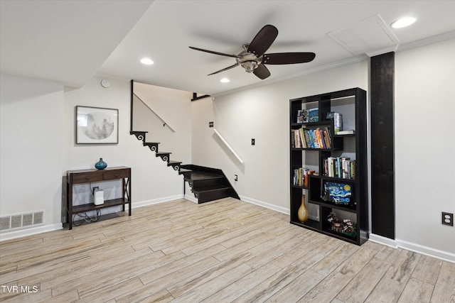 interior space featuring visible vents, baseboards, stairs, recessed lighting, and wood finished floors