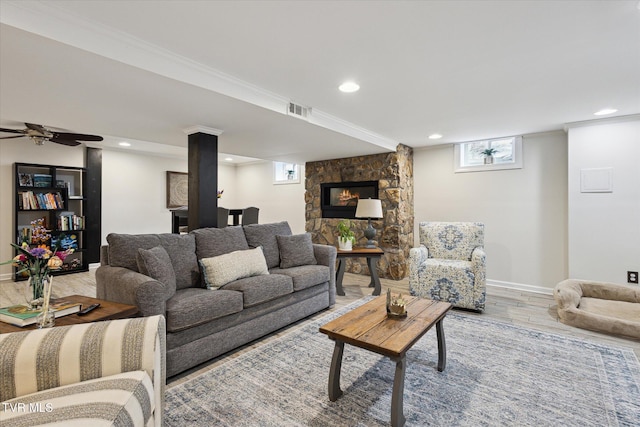 living area featuring recessed lighting, light wood-style floors, visible vents, and a healthy amount of sunlight