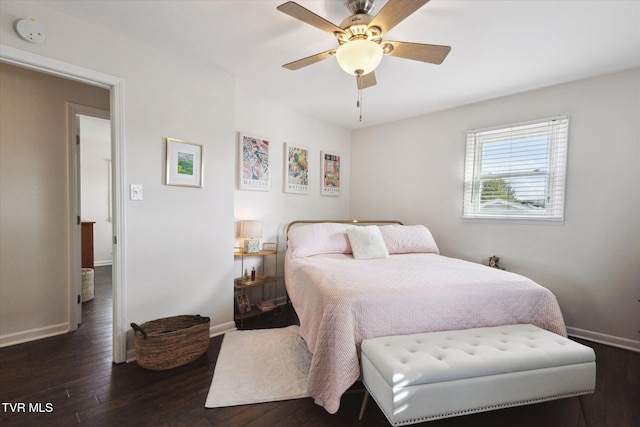 bedroom featuring a ceiling fan, baseboards, and hardwood / wood-style floors