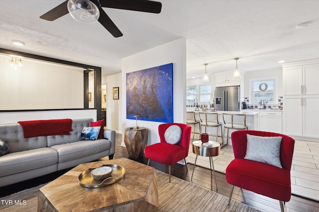 living room with ceiling fan