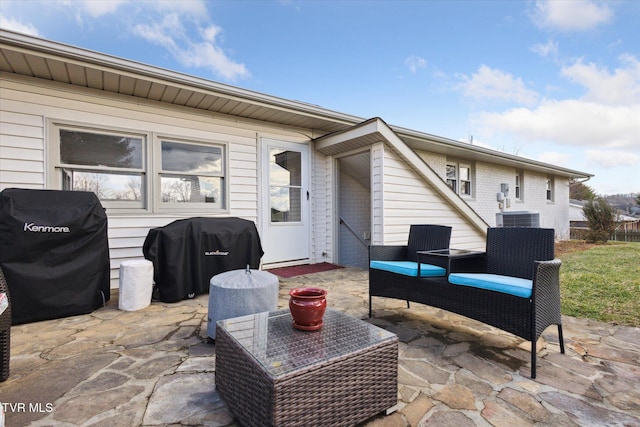 view of patio featuring a grill and central AC