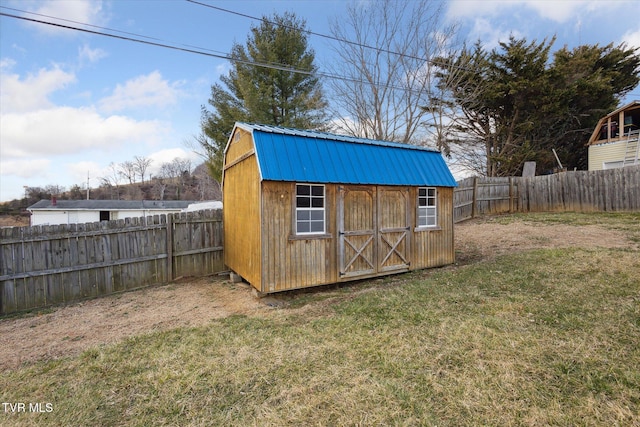 view of shed featuring a fenced backyard