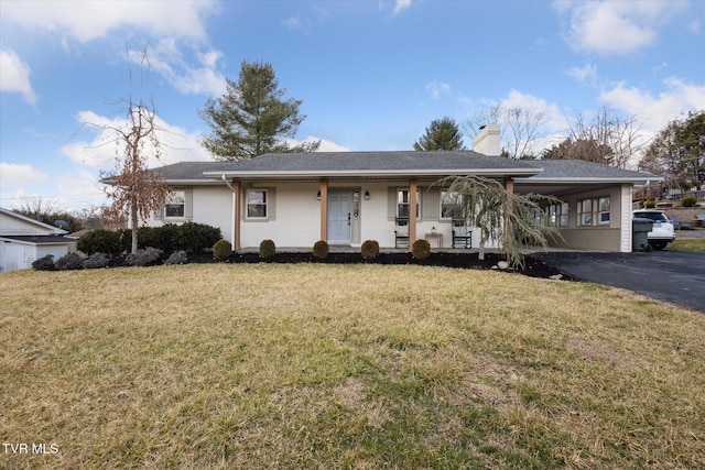 ranch-style home with a porch, a chimney, and a front lawn